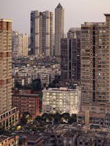 Apartment buildings at dusk in a city of tall buildings