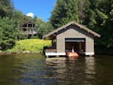 Log fretwork on the covered porch overlooking Upper Saranac Lake evokes the Adirondack’s golden architectural era.