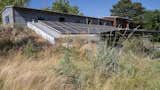 Exterior, Green Siding Material, Metal Siding Material, House Building Type, Metal Roof Material, Stucco Siding Material, Concrete Siding Material, Shed RoofLine, Flat RoofLine, A-Frame RoofLine, and Green Roof Material Exterior - Backyard and Solar Array  Photo 2 of 34 in The Palimpsest House by Tara Lord