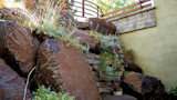 Exterior Side Wall of Basalt Boulders  Photo 12 of 34 in The Palimpsest House by Tara Lord