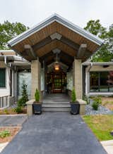 Exterior, Green Siding Material, Concrete Siding Material, Wood Siding Material, House Building Type, Green Roof Material, Stone Siding Material, Metal Roof Material, and Metal Siding Material Entrance  Photo 12 of 20 in Irene Creek by Johnston Design Group