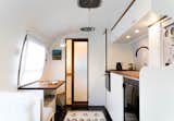 "I wanted it to feel like an old Airstream, just with a refreshed new face. So I decided to start with white and have only one wood tone, walnut," says August.