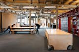 Movable furniture on the sixth floor can be configured as workstations, bleachers, or open space. 