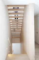 Riserless stairways connect the home’s three levels while allowing light to filter down below.