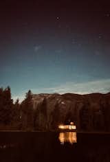 At night the cabin glows like the last ember in a campfire.