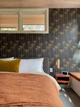 Bedroom, Bed, Porcelain Tile Floor, Bench, Night Stands, and Ceiling Lighting Lake suite features plush bedding from Parachute and furniture from Blu Dot.  Photo 11 of 32 in Après Cabin by Justin Calvo