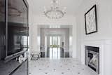 Hallway and Marble Floor Serene water views draw you in from the moment you enter the striking entry hall w/ 12’+ ceilings and wide custom mouldings  Photo 3 of 8 in The Nest by Michelle&Company