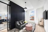 Downstairs, just beyond the entertaining space is a media room closed off by glass pocket doors. This can easily be converted to a fourth bedroom. 
  Photo 6 of 11 in Exquisite Dumbo Penthouse in Award Winning Condo by Halstead Real Estate