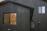 New England Forest House featuring yakisugi (shou sugi ban) japanese charred wood siding