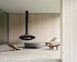 Sheffield residence by Vincent Appel / Of Possible covered terrace with hanging fireplace