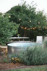 This summer, Clint added a stock tank pool near the back of the yard.
