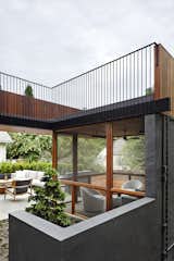 Stephenson House by Assembledge+ and Fowlkes Studio terrace and screened porch
