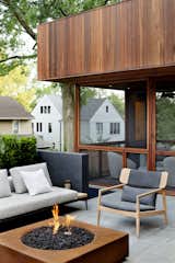 A fire pit and heaters inside the screened-in porch allow for continued use of the outdoor spaces even as the temperatures drop.