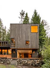 Exterior, House Building Type, Flat RoofLine, and Wood Siding Material The exterior of the extended yoga studio and primary bedroom wing. The deck is constructed of batu, which was chosen over ipe to keep costs down.  Photos from Before & After: A Yoga Teacher’s Growing Studio Spurs a Sensational Home Renovation