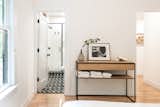After: They removed the glass blocks and added direct access to the bathroom, creating a proper en suite primary bedroom.