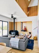 The couple hired architect Matthew Hufft to design a simple house where they could spend time with friends and family, and rent out to vacationers. The interior of the three-bedroom, two-bathroom home is white with birch plywood, the latter material influenced by Jon's work with Scandinavian cabins at Getaway.
