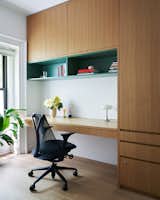 After: Kelly uses her office less, but the cabinet hides one element that's used every single day: a foldout ironing board, a necessity for the couple who founded the gender-defying fashion brand Kirrin Finch.