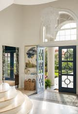 Grand French blue entry doors with a beautiful Turkish area rug.  Photo 1 of 10 in St. Petersburg Luxury Waterfront Home by Angelica Angeli