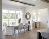 Statement lighting adds a focal point in this formal dining area.