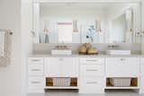 Bath Room The main bathroom has gold accents and a beautiful mirror.  Photo 8 of 12 in Aberdeen Living With European Coastal Elegance by Angelica Angeli