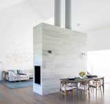 Fireplace wall acts as a focal point and room divider