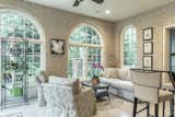 The living space boasts plush furnishings and thoughtful decor