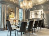 Dining room with glossy walls and silvered ceiling wallpaper