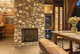 Stone-clad fireplace creates a striking focal point