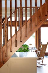 Slat walls replaced solid stairs, freeing up kitchen space