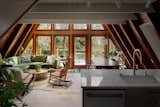A relaxing living area with large windows and cozy furniture