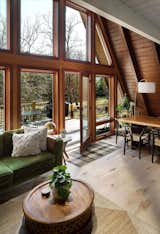 Window-paneled door beautifully bridges indoor living with nature