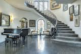 The foyer radiates warmth with gilded details and modern charm