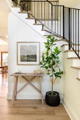Collected decor and a hint of greenery bring depth to this space