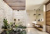 Bath Room, Drop In Sink, Stone Slab Wall, Travertine Floor, and Open Shower  Photos from Jungle Keva