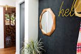 Entry way nook, with custom laser cut sliding barn door leading into mudroom/laundry room