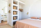 Bedroom, Wall Lighting, and Bed The master bedroom’s built-in arch stands in for a headboard, while custom storage streamlines the area.  Photo 8 of 14 in Desert Wild Joshua Tree by Louis Litrenta