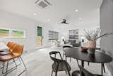View of the Kitchen Area from the bar and seating near the striped wallpaper accent wall.