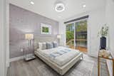 Bedroom Two is located near the rear doorway, across the hall from Bedroom One, and features a sliding door to the Boardwalk Deck.