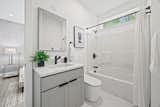 Bathroom Two also features a touchscreen smart mirror, and a smart toilet, that auto open, closes, flushes, and has heated seats, and warm water bidet and air dry functionality.