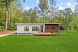 The FUTRHOMES QUANTUM is a custom bespoke modern ranch home with detailed Nordic Slat facia with wide fiber cement planked siding with mitered corners.