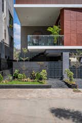 An Entrance leading to the private home is flanked by an amazing foliage of landscape done on the sides of main gate. 