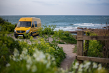 UK-based couple Charlie Low and Dale Comley converted this former DHL delivery van into a tiny home-on-wheels that would take them on new climbing adventures.  Photo 2 of 22 in Budget Breakdown: A Climbing Couple Turn a Delivery Van Into an Adventure Mobile for $8.5K