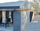 The semi-cantilevered roof uses an invisible truss system. Similarly to the volcanic rocks, while the roof appears dense and unwieldy, it is also light yet sturdy.  Photo 8 of 11 in A Chunk of Volcanic Stone Inspires a Rock-Solid Sonoma Home