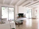 Living Room, Ceiling Lighting, Light Hardwood Floor, Chair, Sofa, Coffee Tables, and Gas Burning Fireplace Living Room  Photo 6 of 9 in The Oscar House by Todd Bachenheimer