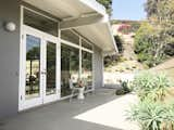 Outdoor, Wood Fences, Wall, Trees, Hardscapes, Back Yard, Concrete Patio, Porch, Deck, Landscape Lighting, Horizontal Fences, Wall, and Large Patio, Porch, Deck Exterior   Photo 8 of 9 in The Oscar House by Todd Bachenheimer