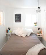 The compact but bright master bedroom .