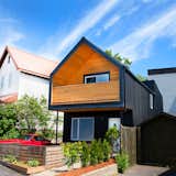 The 'A' frame roof line allows the modern renovation to match the vernacular of the neighbourhood.