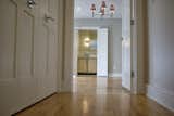 Hall leading to master bedroom. The home features two hallways that lead to private spaces.