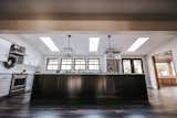 Kitchen, Pendant Lighting, Refrigerator, White Cabinet, Engineered Quartz Counter, Wood Cabinet, Cooktops, Vinyl Floor, Range, Range Hood, Drop In Sink, and Subway Tile Backsplashe Kitchen  Photo 9 of 32 in Frost by Mackenzie Reynolds