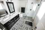 Bath Room, Two Piece Toilet, Concrete Floor, Enclosed Shower, Marble Counter, Corner Shower, and Subway Tile Wall Master Bathroom  Photo 1 of 42 in Avenue Stone by Mackenzie Reynolds